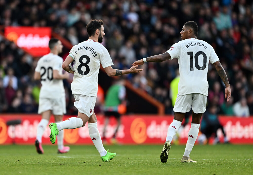 Bruno Fernandes of Manchester United celebrates scoring his team's second goal from the penalty spot with teammate Marcus Rashford during the Premier League match between AFC Bournemouth and Manchester United.