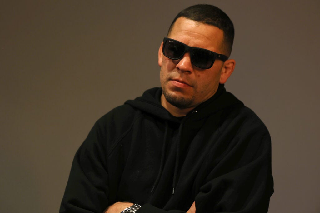 Nate Diaz reacts while talking with media in his dressing room after the Nate Diaz v Jorge Masvidal press event “The Baddest Tour" at The Novo on April 19, 2024 in Los Angeles, California.