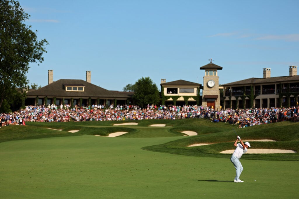 Scottie Scheffler of the United States plays his shot on the 18th hole during the third round of the Memorial Tournament presented by Workday at Muirfield Village Golf Club