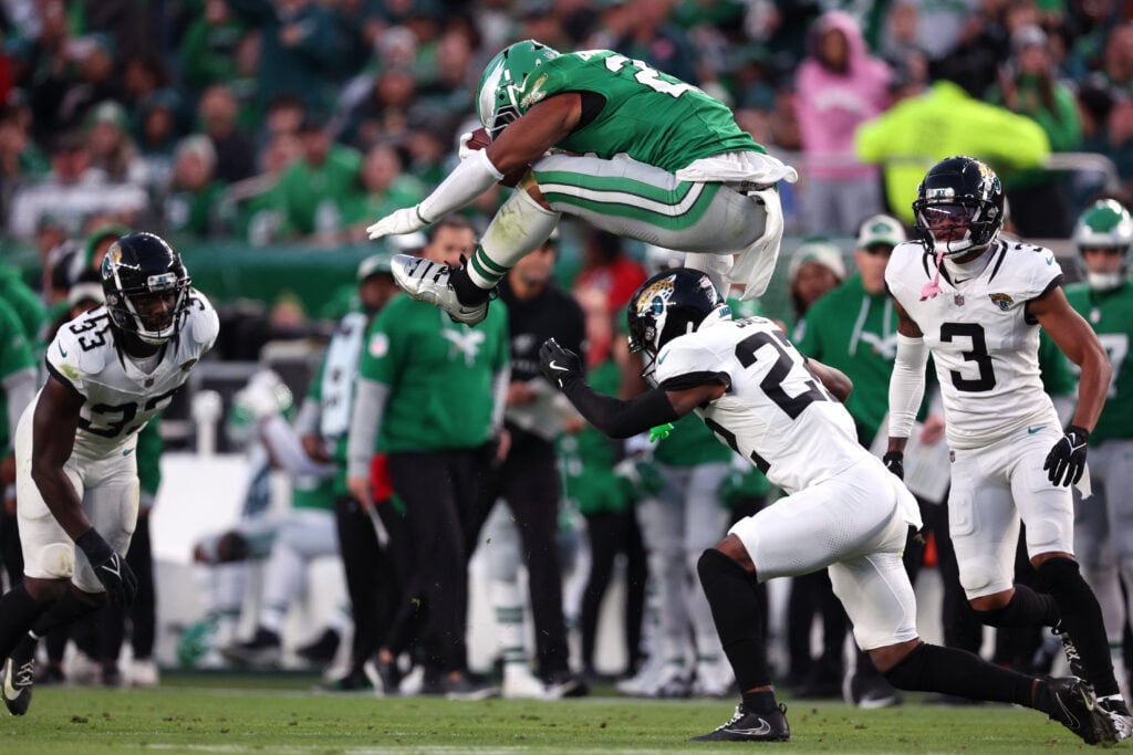 Saquon Barkley #26 of the Philadelphia Eagles hurdles Jarrian Jones #22 of the Jacksonville Jaguars in the second quarter of a game at Lincoln Financial Field