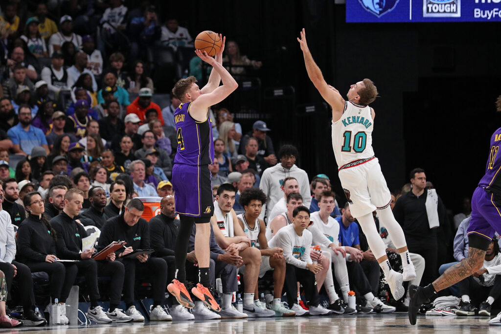 Dalton Knecht #4 of the Los Angeles Lakers takes a shot against Luke Kennard #10 of the Memphis Grizzlies during the game at FedExForum on November 06, 2024 in Memphis, Tennessee.