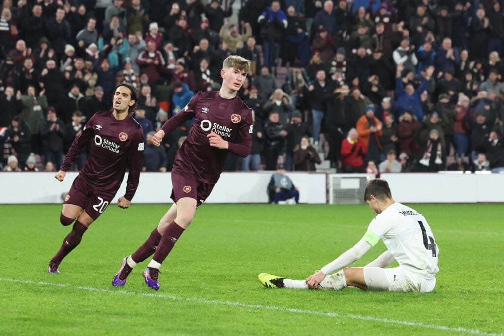 James Wilson of Heart of Midlothian FC celebrates scoring his team's first goal during the UEFA Conference League 2024/25 League Phase MD6 match between Heart of Midlothian FC and FC Petrocub at Tynecastle Stadium on December 19, 2024.