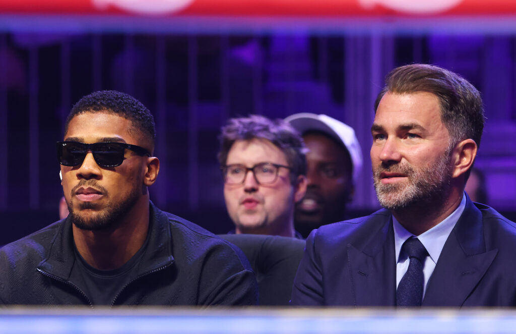 Anthony Joshua and Eddie Hearn, Chairman of Matchroom Sport, look on from ringside during the WBO Interim World Light Heavyweight Title fight between Joshua Buatsi and Callum Smith as part of Beterbiev v Bivol 2: The Last Crescendo at Kingdom Arena on February 22, 2025 in Riyadh, Saudi Arabia.