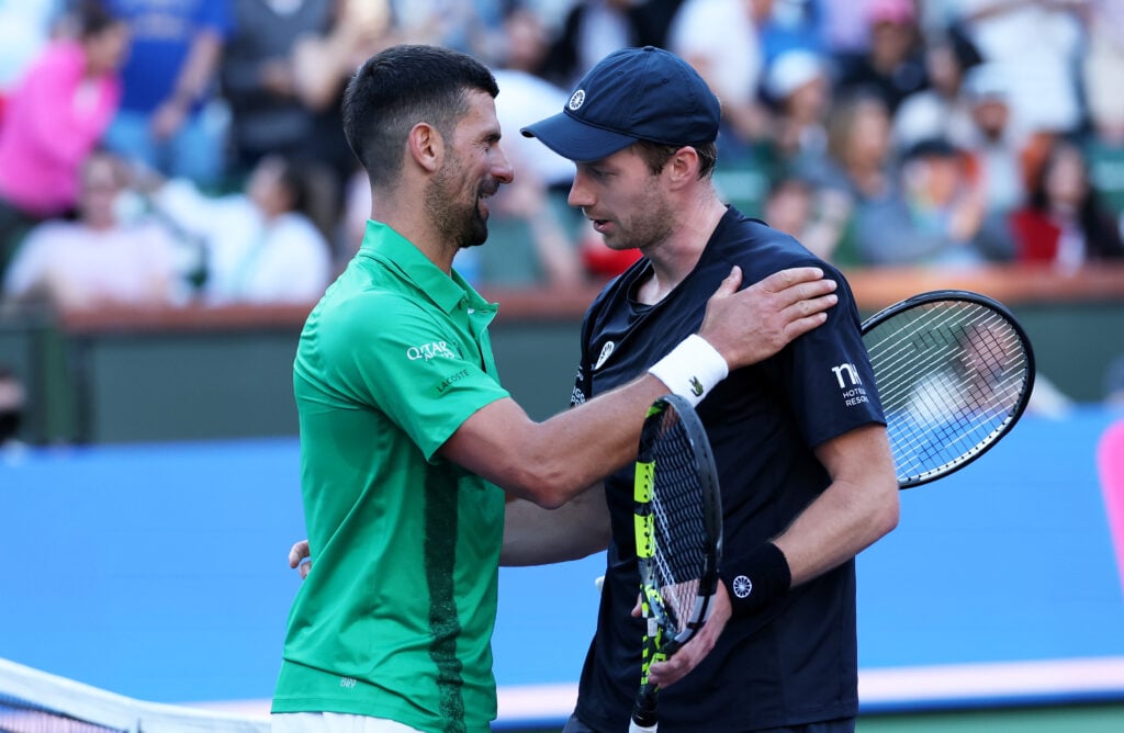 Novak Djokovic and Botic van de Zandschulp embrace after their Indian Wells match in 2025