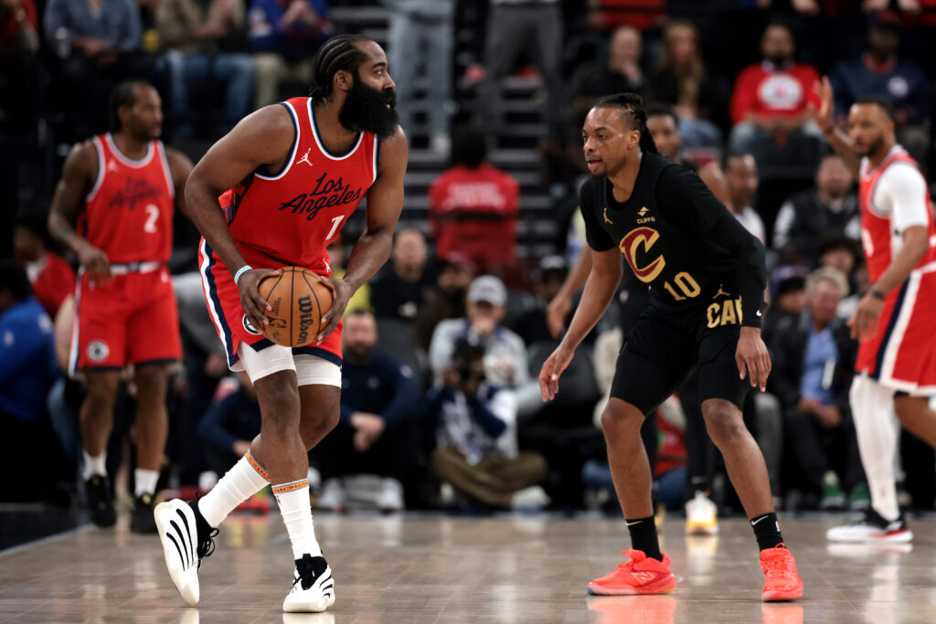 James Harden #1 of the Los Angeles Clippers handles the ball against Darius Garland #10 of the Cleveland Cavaliers during the first quarter at Intuit Dome on March 18, 2025 in Inglewood, California.