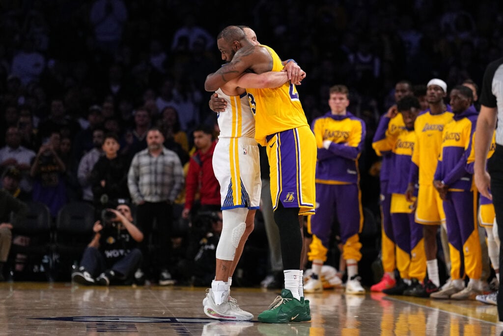 Stephen Curry #30 of the Golden State Warriors and LeBron James #23 of the Los Angeles Lakers share a moment following their game at Crypto.com Arena on April 03, 2025 in Los Angeles, California.
