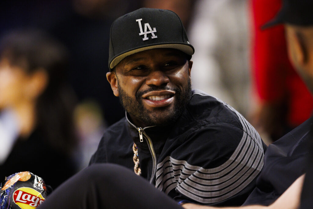 Floyd Mayweather Jr. sits court-side during the first half between the Houston Rockets and the Los Angeles Lakers at Crypto.com Arena.