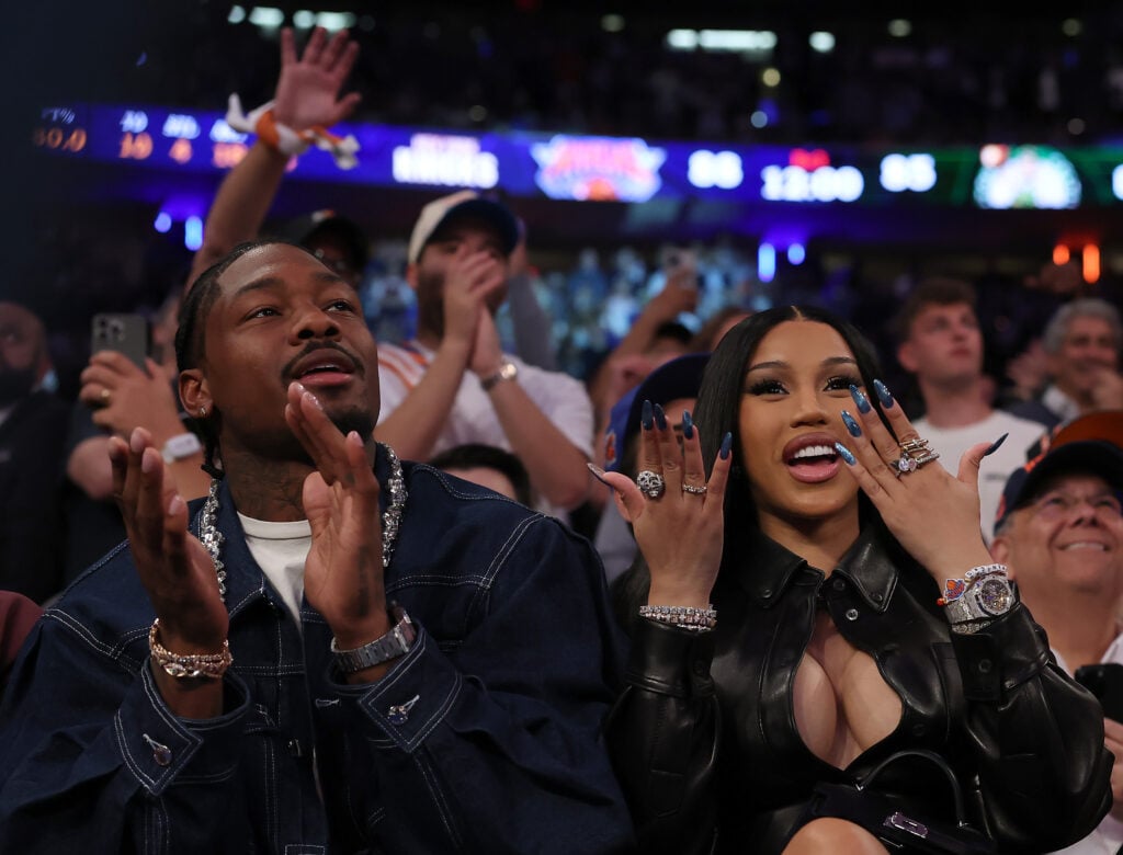 NFL Player Stefon Diggs (R) and rapper Cardi B (L) celebrate in the fourth quarter of Game Four of the Eastern Conference Second Round NBA Playoffs between the Boston Celtics and the New York Knicks at Madison Square Garden on May 12, 2025 in New York City.