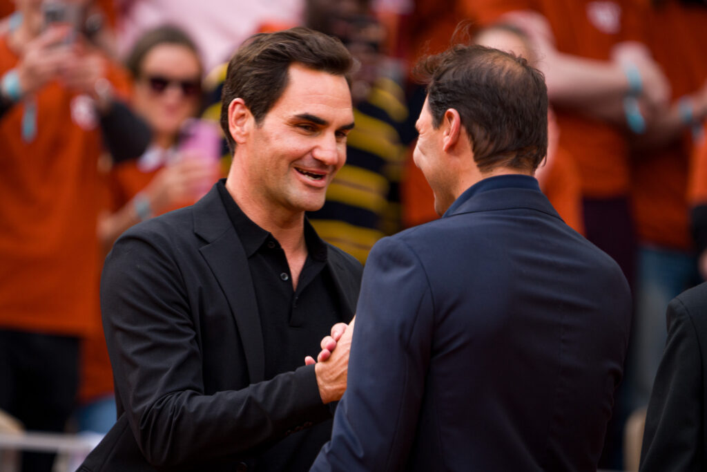 Roger Federer and Rafael Nadal embrace at the 2025 French Open