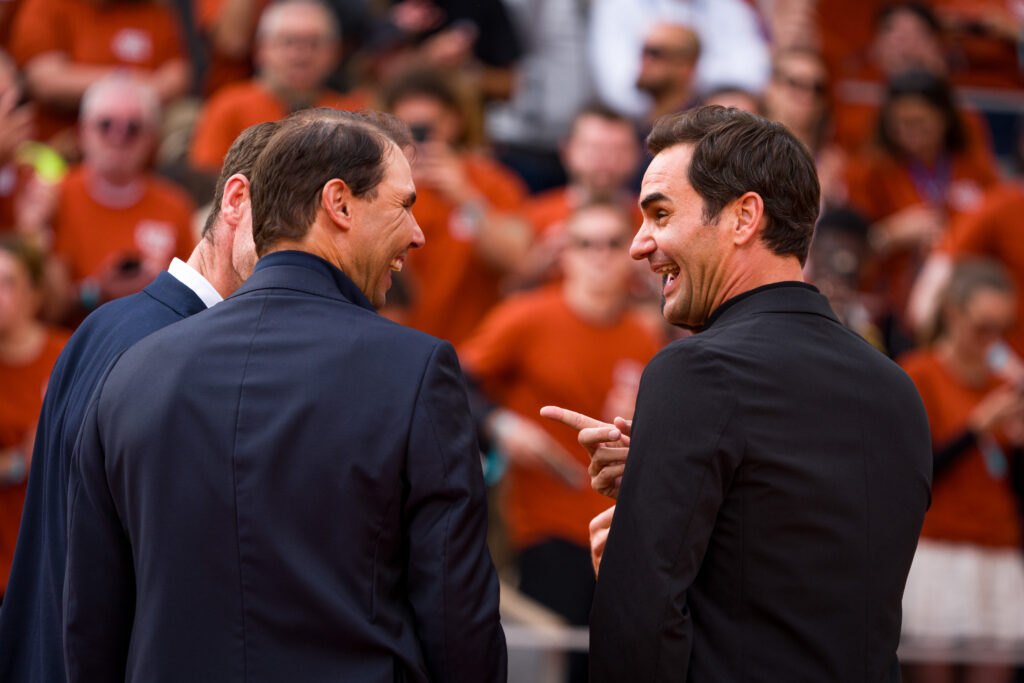 Roger Federer and Rafael Nadal talk with each other.
