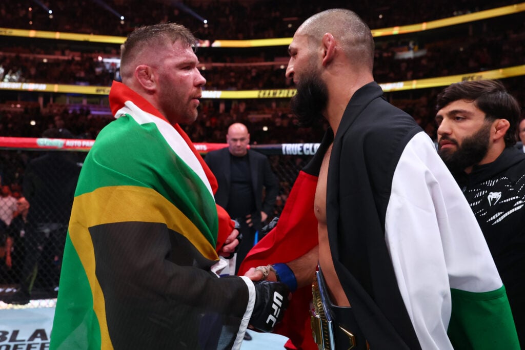 Khamzat Chimaev of Russia and Dricus Du Plessis of South Africa talk after the UFC middleweight championship fight during the UFC 319 event at the United Center.