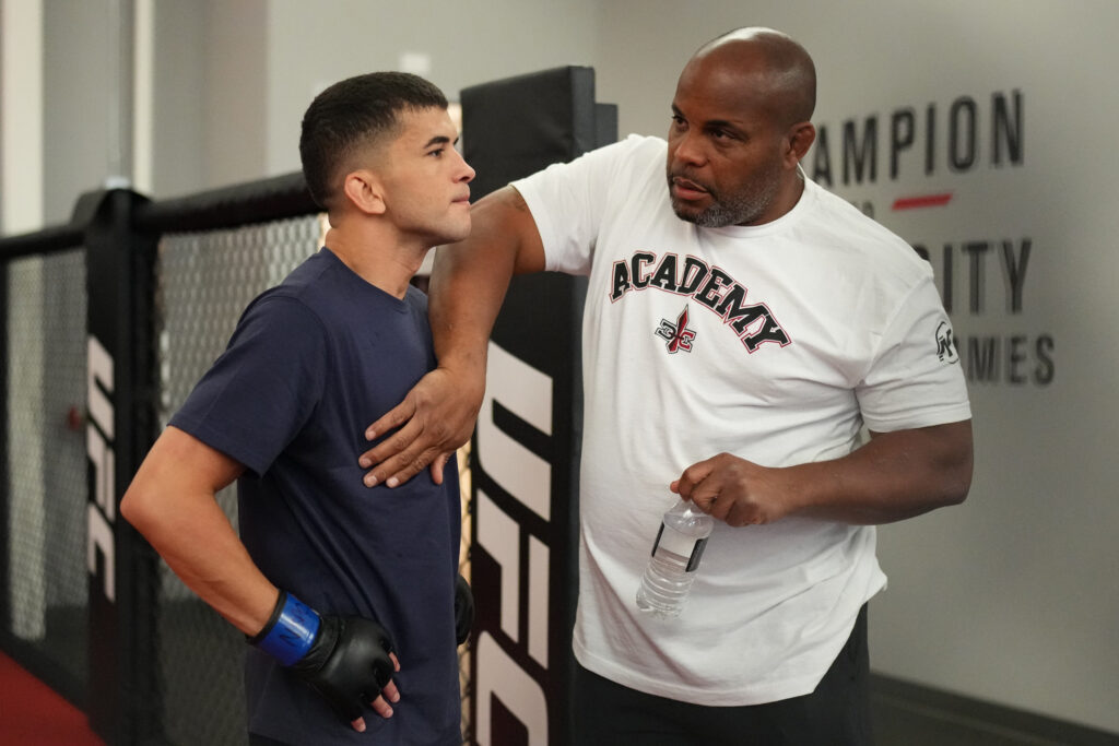 Daniel Cormier talks with Eduardo Chapolin of Brazil backstage prior to his fight during Dana White's Contender Series season nine, week four at UFC APEX on September 02, 2025 in Las Vegas, Nevada.