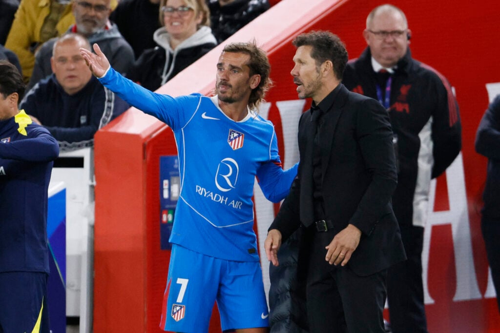 Antoine Griezmann of Atletico Madrid and Diego Simeone, head coach of Atletico Madrid on the side line during the UEFA Champions League 2025/26 League Phase MD1 match between Liverpool FC and Atletico de Madrid at Anfield.