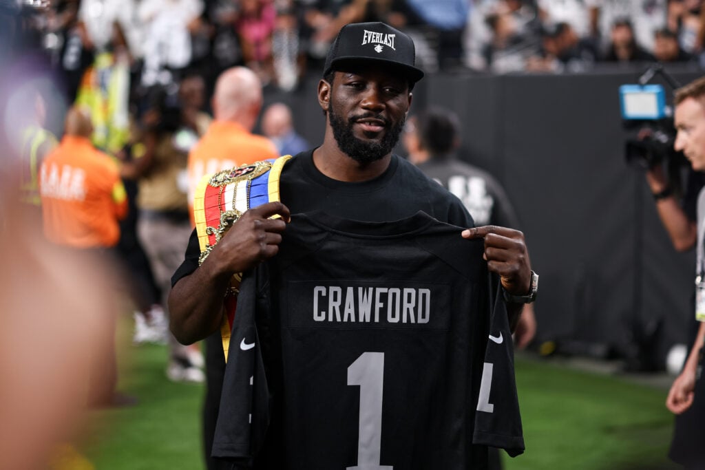 Ring Magazine Super Middleweight Champion Terence Crawford poses for a photo with a custom jersey prior to the game between the Las Vegas Raiders and Los Angeles Chargers at Allegiant Stadium on September 15, 2025 in Las Vegas, Nevada.