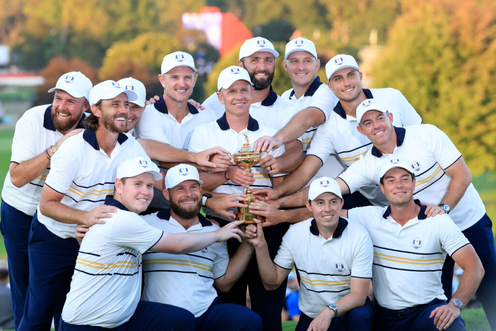 Europe Captain Luke Donald, Shane Lowry, Rasmus Hojgaard, Justin Rose, Jon Rahm, Sepp Straka, Ludvig Aberg, Rory McIlroy, Viktor Hovland, Matt Fitzpatrick, Tommy Fleetwood, Robert MacIntyre and Tyrrell Hatton of Team Europe hold the Ryder Cup trophy