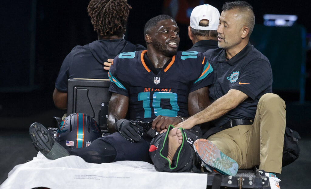 Miami Dolphins wide receiver Tyreek Hill (10) is carted off after an injury in the second half of the NFL game against the New York Jets at Hard Rock Stadium.