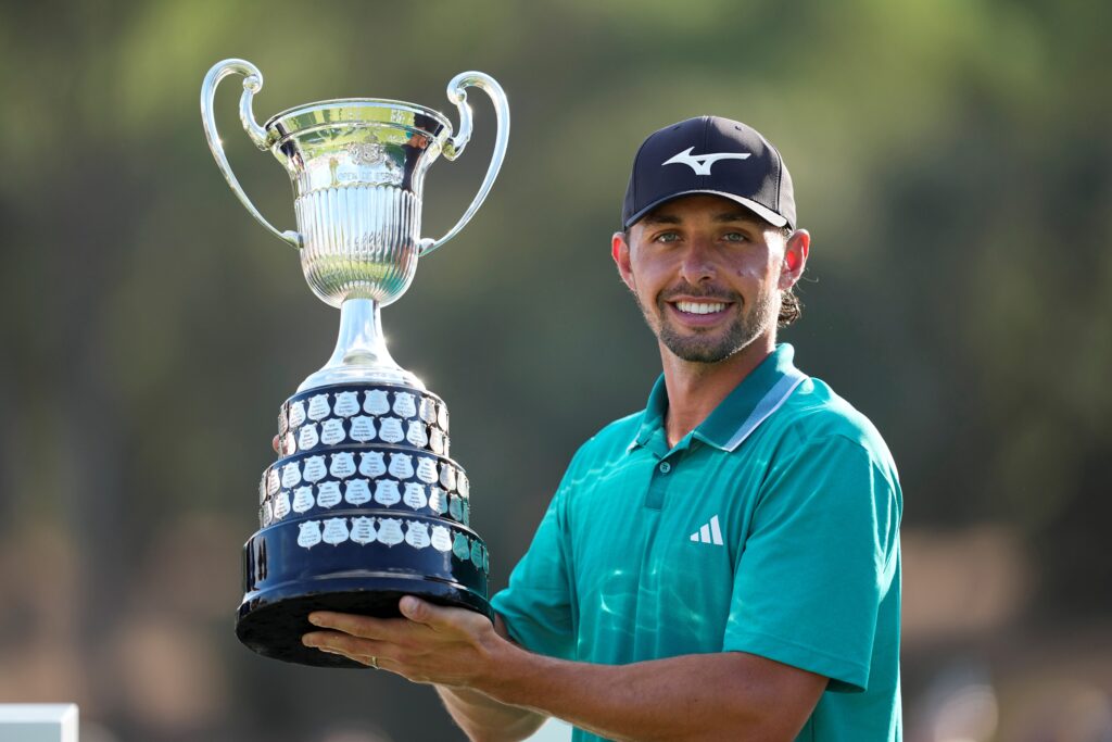 Marco Penge of England celebrates with the Champion Trophy during the Open de España