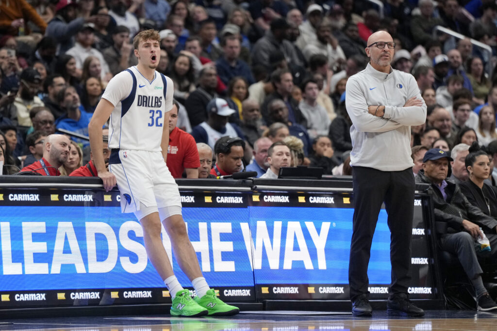 Cooper Flagg #32 and Jason Kidd of the Dallas Mavericks look on from the sidelines during the first half against the Washington Wizards at Capital One Arena on November 08, 2025.