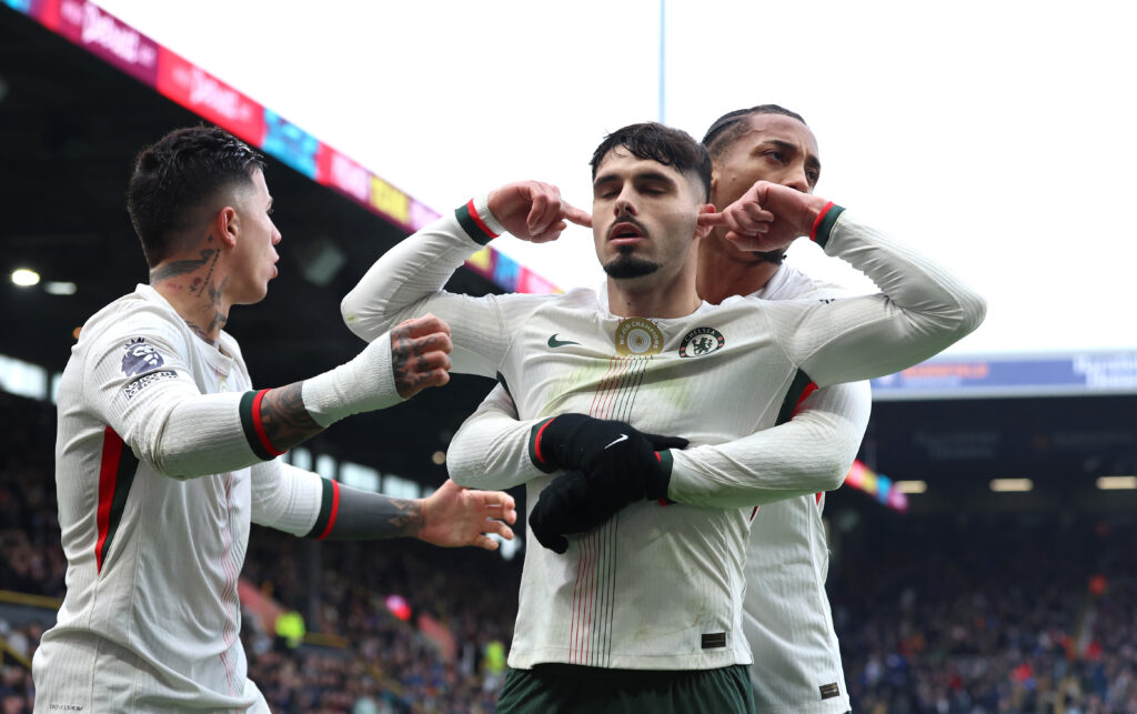 Pedro Neto of Chelsea celebrates scoring his team's first goal with teammate Joao Pedro during the Premier League match between Burnley and Chelsea at Turf Moor.