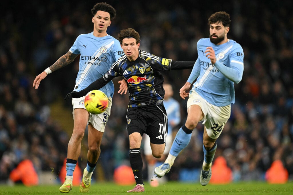 Manchester City's English midfielder #33 Nico O'Reilly (L) and Manchester City's Croatian defender #24 Josko Gvardiol (R) vie with Leeds United's US midfielder #11 Brenden Aaronson during the English Premier League football match between Manchester City and Leeds United at the Etihad Stadium.