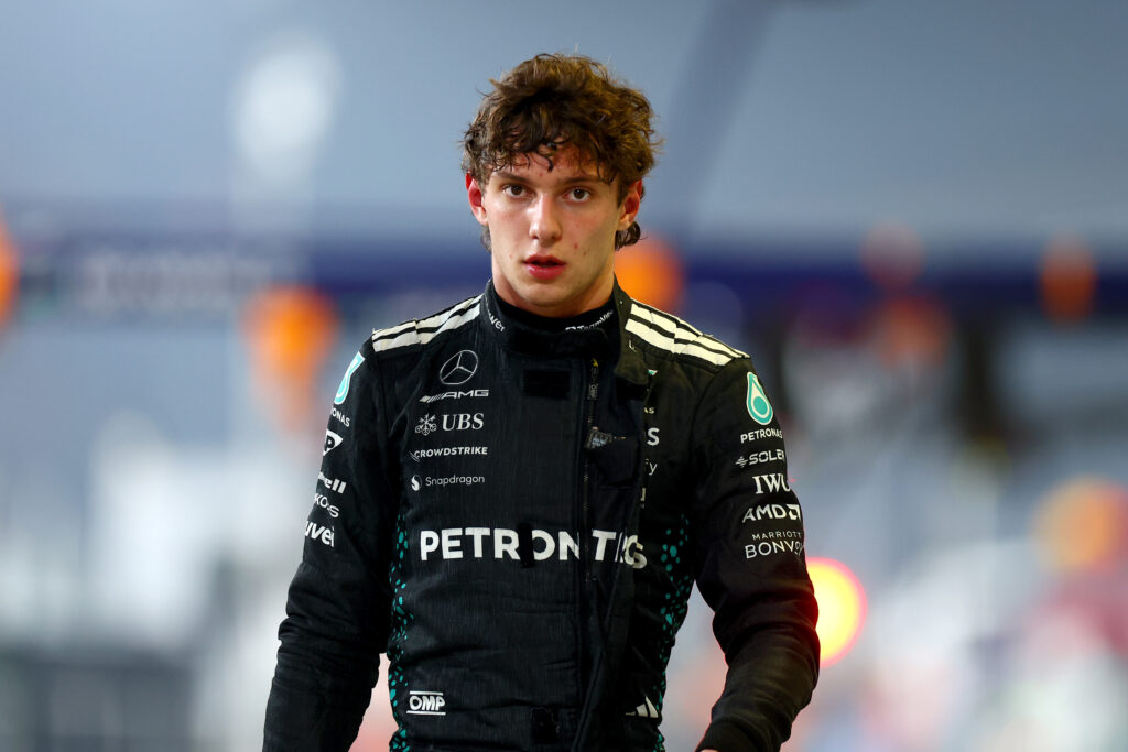 Fourteenth placed qualifier Andrea Kimi Antonelli of Italy and Mercedes AMG Petronas F1 Team walks in the Pitlane during qualifying ahead of the F1 Grand Prix of Abu Dhabi at Yas Marina Circuit on December 06, 2025 in Abu Dhabi, United Arab Emirates.