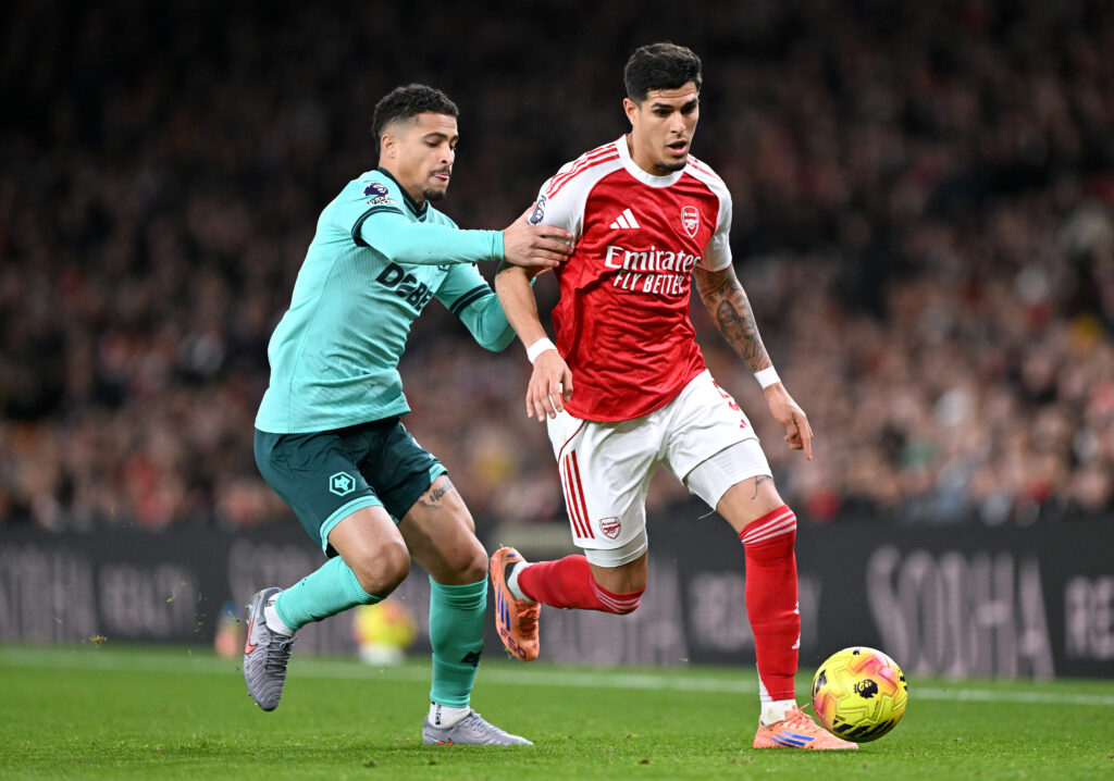 Piero Hincapie of Arsenal is challenged by Joao Gomes of Wolverhampton Wanderers during the Premier League match between Arsenal and Wolverhampton Wanderers at Emirates Stadium.