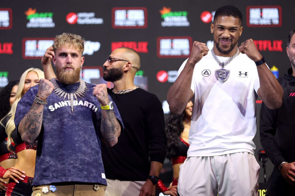 Jake Paul and Anthony Joshua face off during the press conference for Jake Paul v Anthony Joshua at The Fillmore Miami Beach on December 17, 2025 in Miami Beach, Florida.