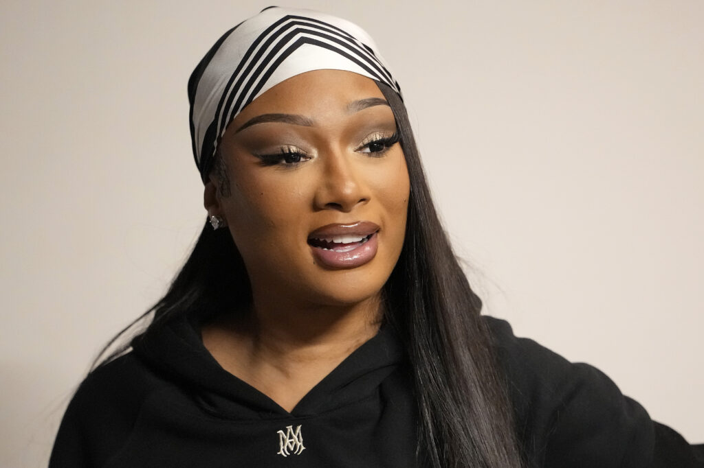 Megan Thee Stallion, American rapper and songwriter looks on at half time during the game between the Dallas Mavericks and Sacramento Kings at Golden 1 Center on December 27, 2025 in Sacramento, California.