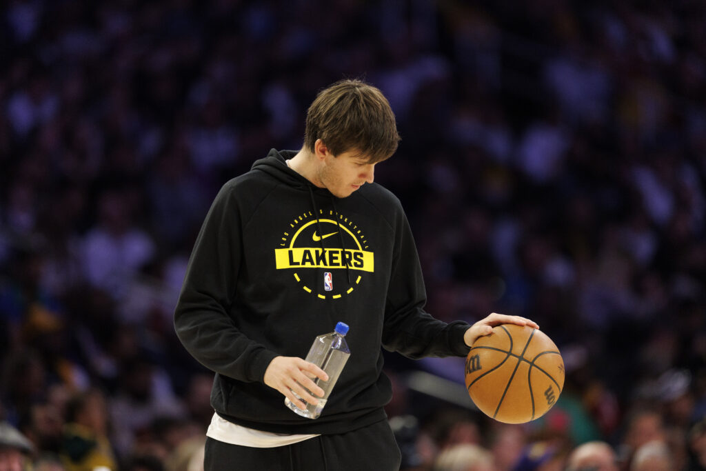 Injured Los Angeles Lakers guard Austin Reaves (15) bounces the ball during a timeout in the game against the Memphis Grizzlies at Crypto.com Arena.