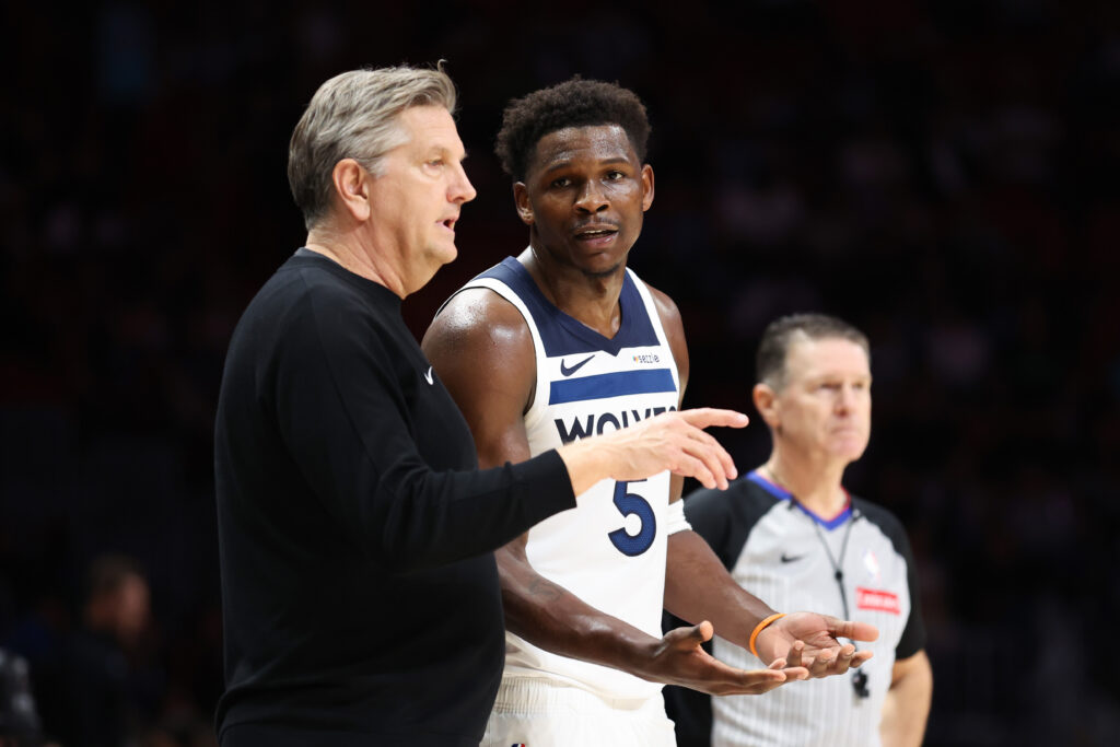 Head coach Chris Finch and Anthony Edwards #5 of the Minnesota Timberwolves speak on the court during the fourth quarter of the game against the Miami Heat at Kaseya Center on January 03, 2026 in Miami, Florida.