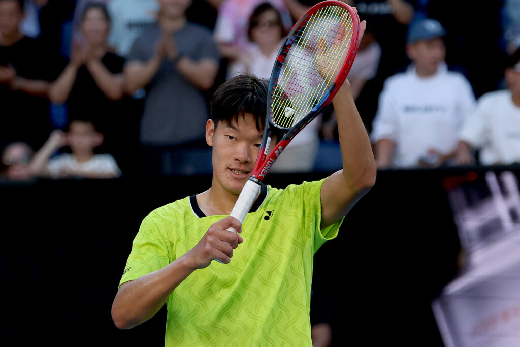Michael Zheng celebrates after beating Sebastian Korda at the 2026 Australian Open.