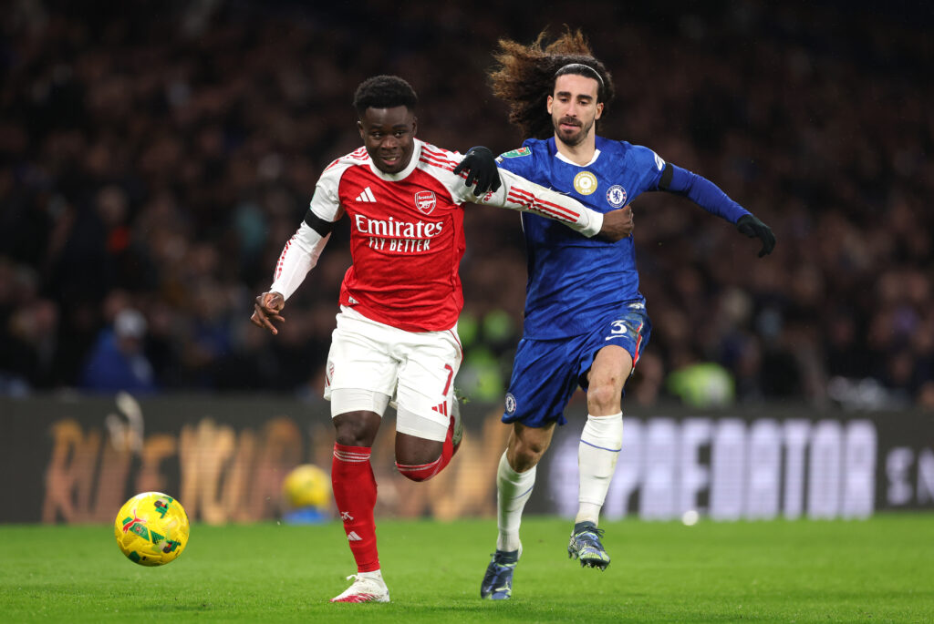 Bukayo Saka of Arsenal is tackled by Marc Cucurella of Chelsea during the Carabao Cup Semi Final First Leg match between Chelsea and Arsenal at Stamford Bridge on January 14, 2026 in London, England.