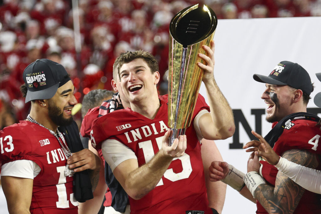 Fernando Mendoza #15 of the Indiana Hoosiers raises the National Championship Trophy after Indiana defeated the Miami Hurricanes 27-21 in the 2026 College Football Playoff National Championship at Hard Rock Stadium on January 19, 2026 in Miami Gardens, Florida.