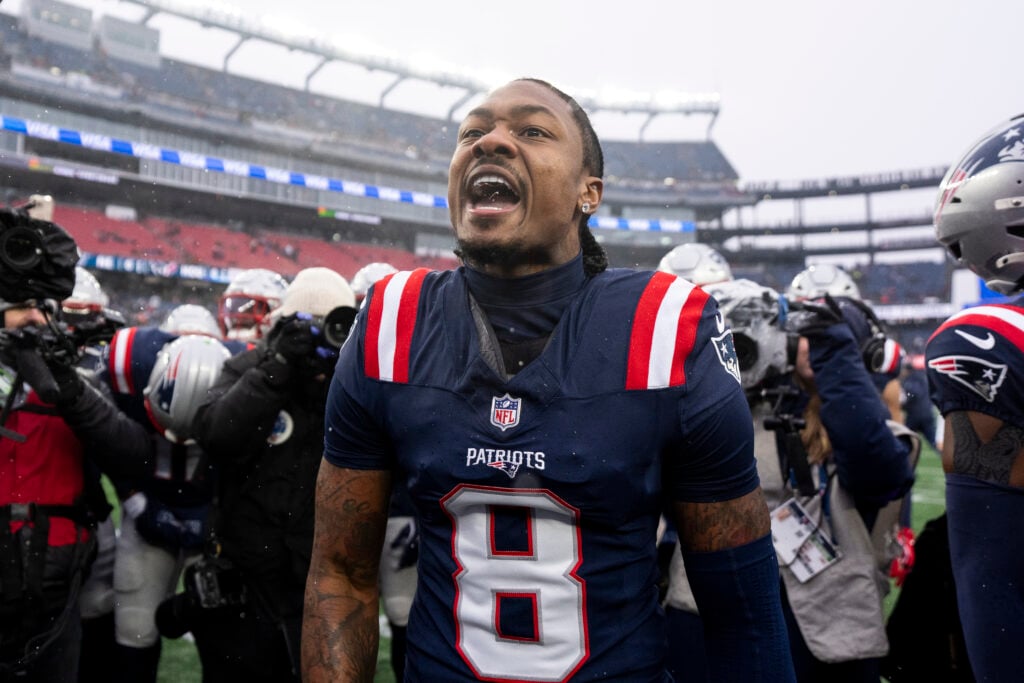 Stefon Diggs #8 of the New England Patriots reacts as he leads a huddle prior to an NFC Divisional Playoff game against the Houston Texans at Gillette Stadium.