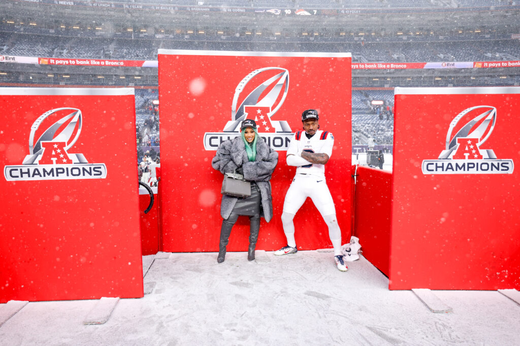Cardi B and Stefon Diggs #8 of the New England Patriots pose for a portrait after the AFC Championship game against the Denver Broncos.