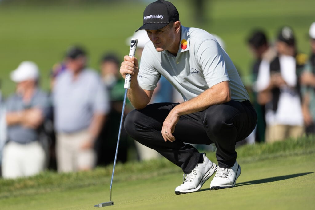 Justin rose lines up a shot on the on the South course sixth green during the final round of the Farmers Insurance Open