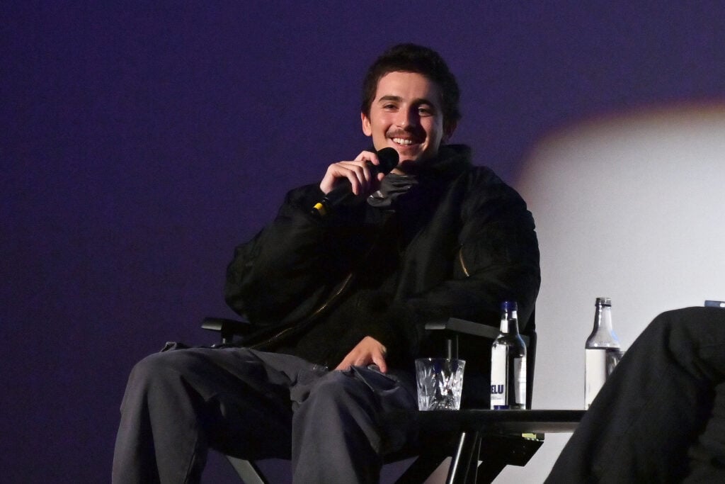 Timothee Chalamet speaks on stage during a Q&A at a special screening of Marty Supreme at The Curzon Mayfair.