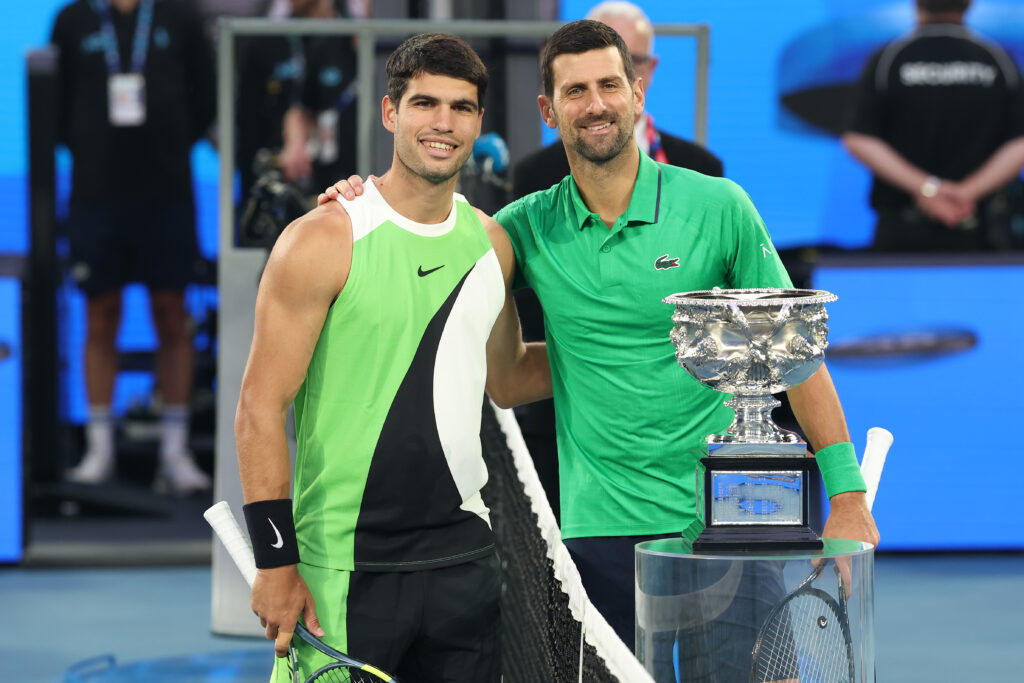 Carlos Alcaraz (L) and Novak Djokovic (R) pose prior to the Men's Singles Final during day 15 of the 2026 Australian Open