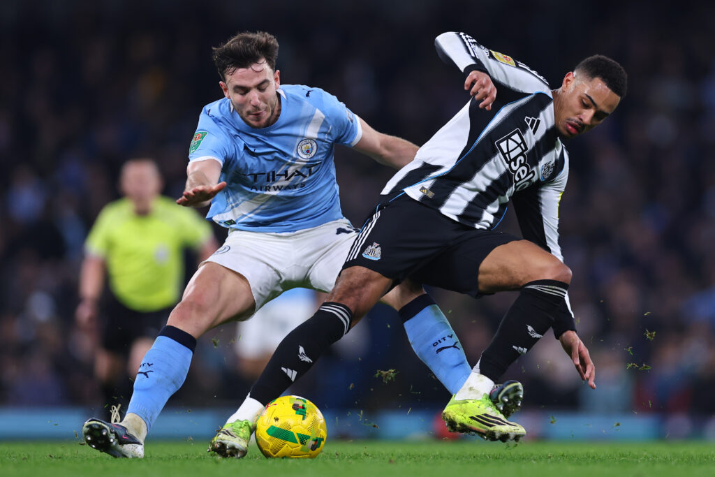 Matheus Nunes of Manchester City and Jacob Ramsey of Newcastle United during the Carabao Cup Semi Final Second Leg match between Manchester City and Newcastle United at Etihad Stadium.