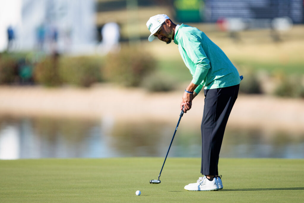 Mookie Betts of the Los Angeles Dodgers putts on the 11th green prior to the WM Phoenix Open 2026