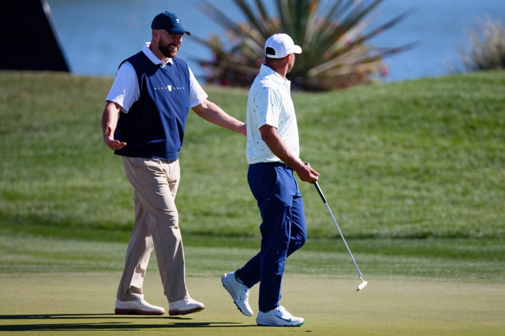 Travis Kelce of the Kansas City Chiefs and Brooks Kopeka of the United States share a laugh prior to the WM Phoenix Open 2026