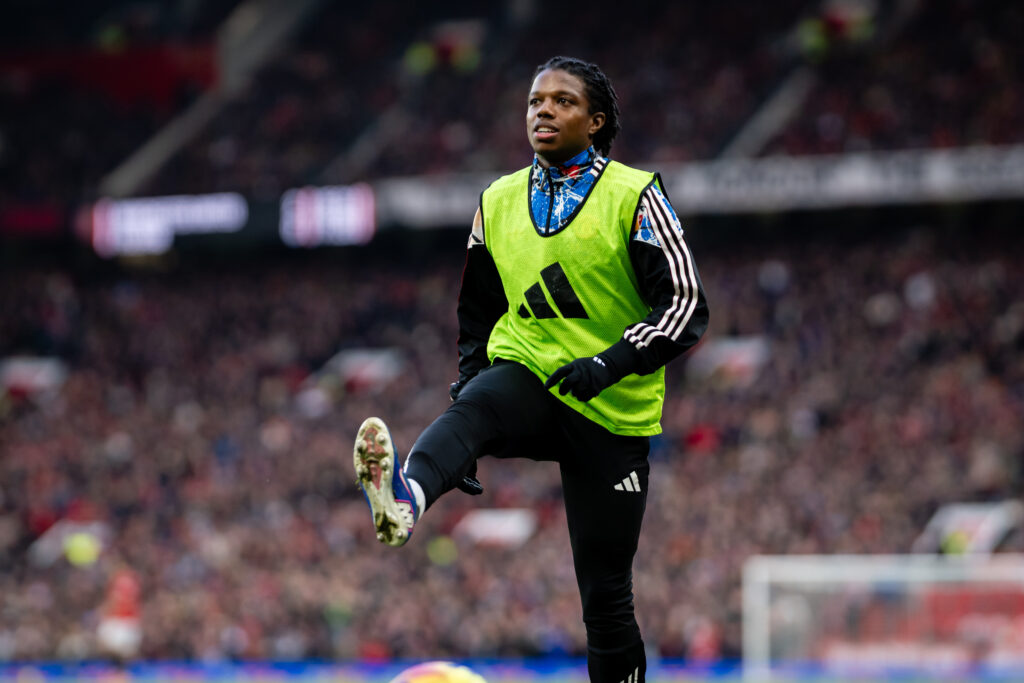 Tyrell Malacia of Manchester United warms up during the Premier League match between Manchester United and Fulham at Old Trafford on February 01, 2026 in Manchester, England.