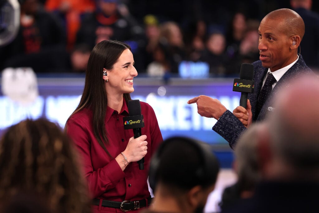 Caitlin Clark talks to Reggie Miller on stage as she joins NBC’s Sunday Night Basketball prior to the game between the Los Angeles Lakers and New York Knicks at Madison Square Garden.