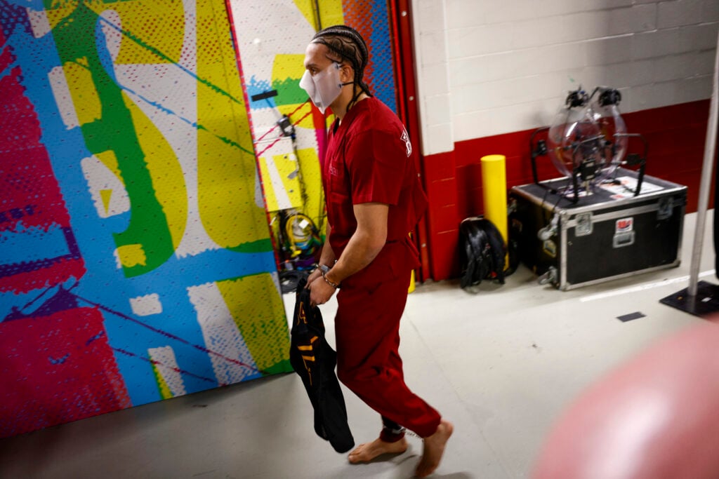New England Patriots' Mack Hollins walks through Levi's Stadium with a prisoner outfit and barefoot before Super Bowl LX between the Seattle Seahawks and New England Patriots in Santa Clara, Calif. on Sunday, Feb. 8, 2026.