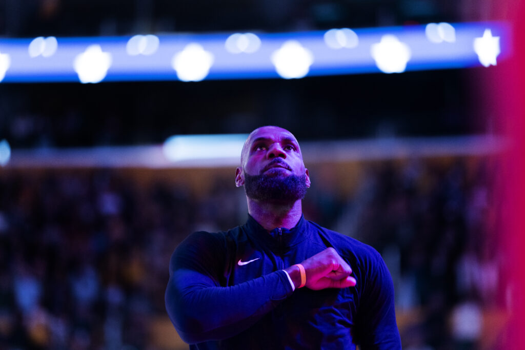 Los Angeles Lakers forward LeBron James (23) pounds his chest after the singing of the Star Spangled Banner before the game against the Golden State Warriors at Crypto.com Arena on February 7, 2026 in Los Angeles, California.