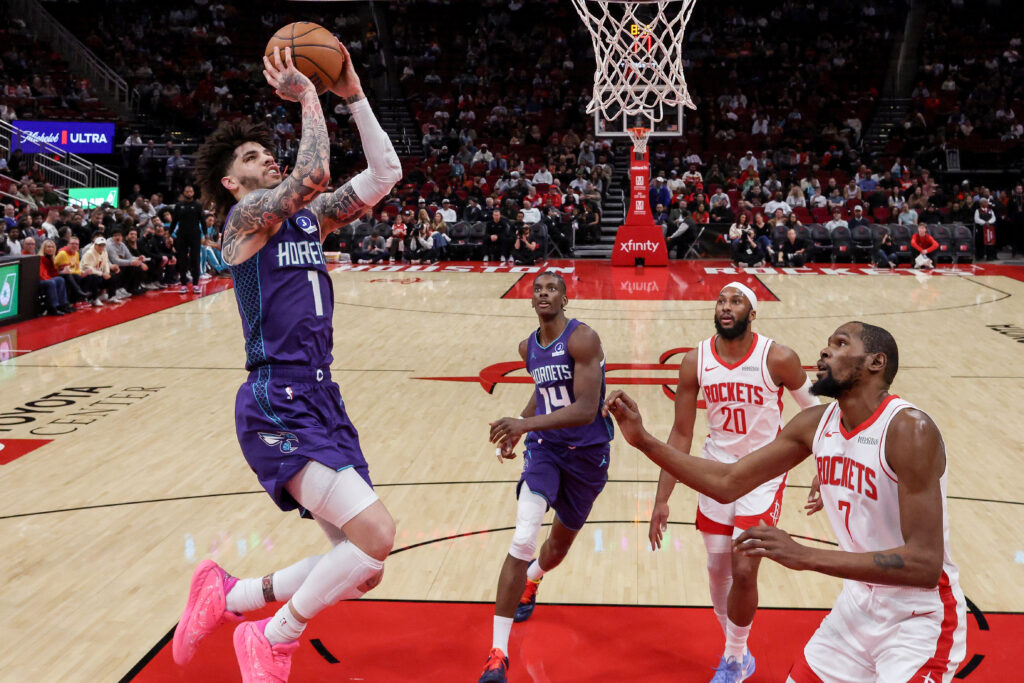 LaMelo Ball #1 of the Charlotte Hornets goes up for a shot against Kevin Durant #7 of the Houston Rockets in the first half at Toyota Center on February 05, 2026 in Houston, Texas.