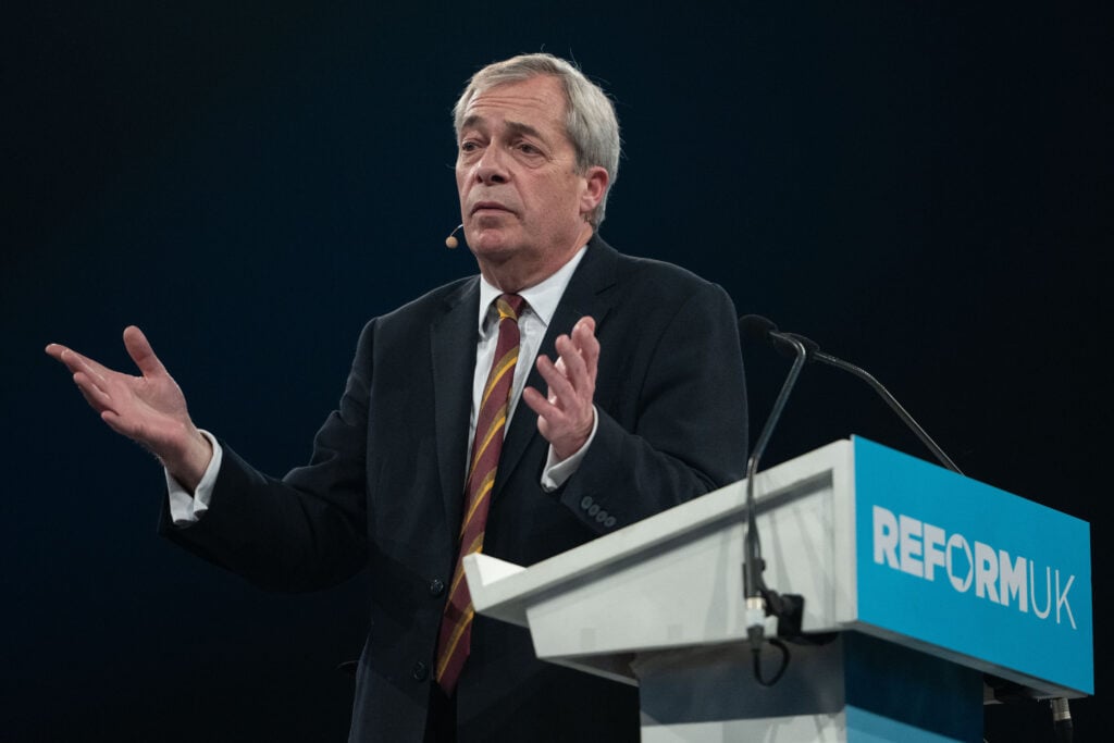 Reform UK leader Nigel Farage speaks during a Reform UK rally at National Exhibition Centre
