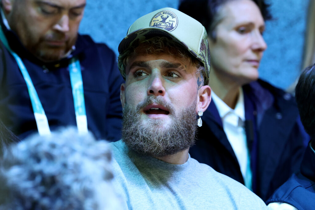 Boxer Jake Paul is seen in the stand during the Women's Preliminary Round Group A match between Finland and United States on day one of the Milano Cortina 2026 Winter Olympic games at Milano Rho Ice Hockey Arena.