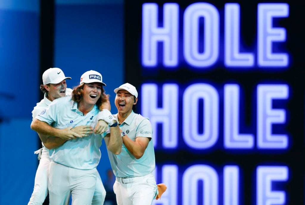 Neal Shipley of The Bay Golf Club reacts with teammates after making a hole-in-one on the fifth hole during a match against Los Angeles Golf Club