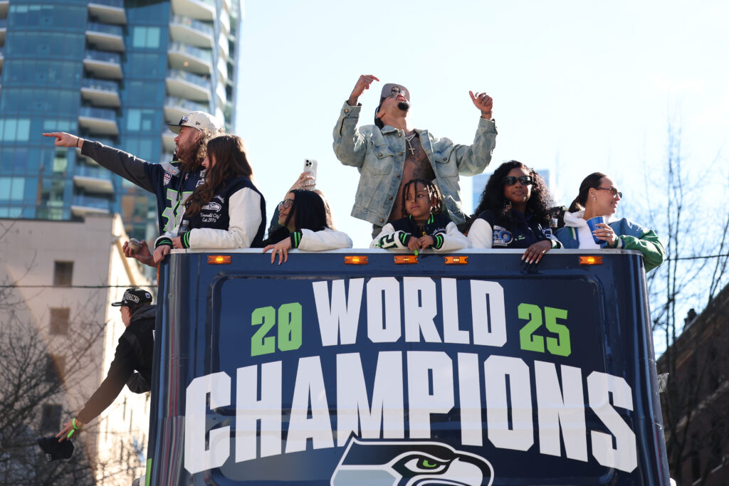 Jaxon Smith-Njigba #11 of the Seattle Seahawks celebrates with fans during the Seattle Seahawks Super Bowl LX victory celebration and parade at Lumen Field on February 11, 2026 in Seattle, Washington.